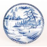 A large late 19th to early 20th Century Japanese export charger decorated in blue and white with