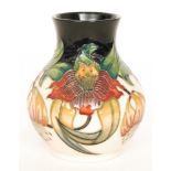 A Moorcroft Pottery baluster vase decorated in the Anna Lily pattern, designed by Nicola Slaney,