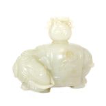 A Chinese celadon jade water vessel carved in the shape of an elephant with head bowed and turned