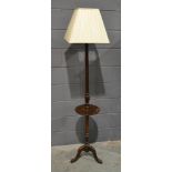 An Edwardian mahogany tripod standard lamp complete with shade,