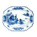 A late 18th to early 19th Century Chinese export meat plate decorated in blue and white with a hand