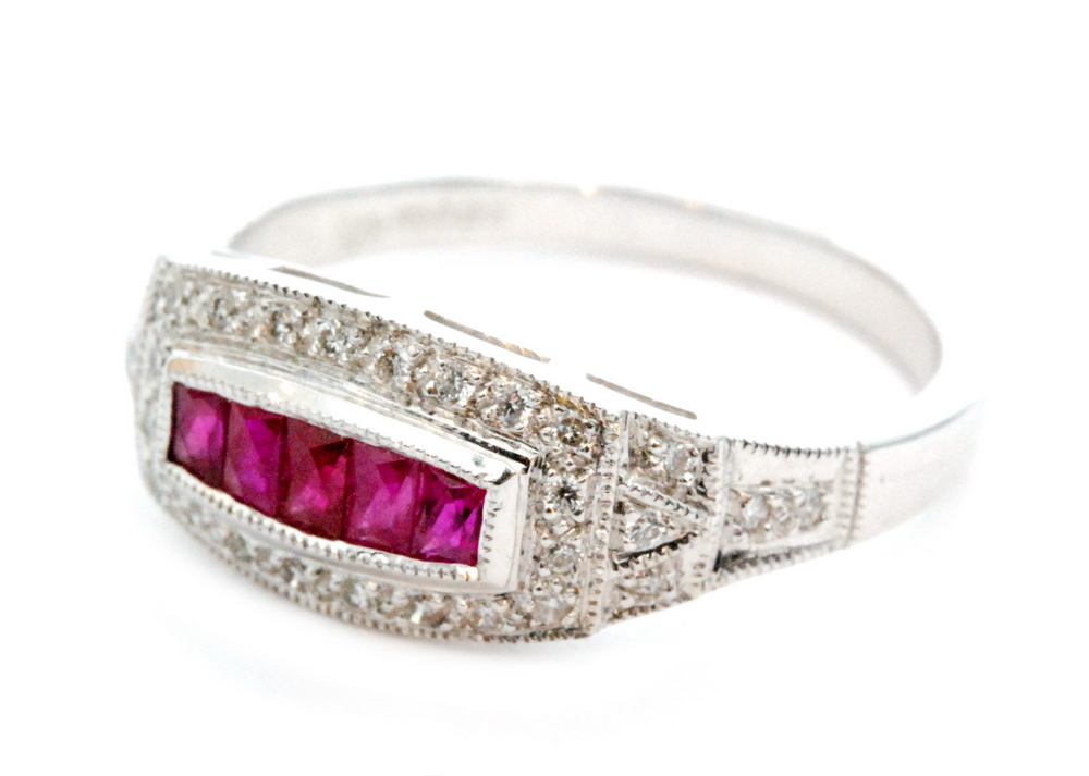 A contemporary 18ct hallmarked white gold ruby and diamond ring,