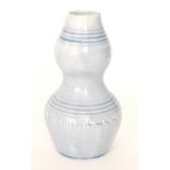 A Moorcroft Natural Pottery vase of double gourd form glazed in a pale blue,