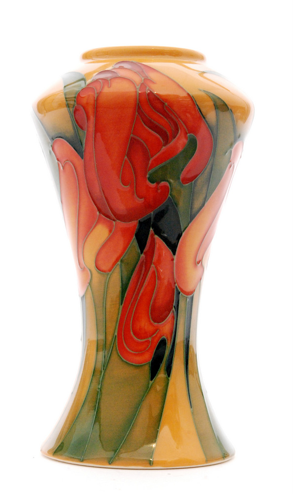 A Moorcroft Pottery vase of slender waisted form decorated in the Gloria pattern designed by Emma