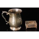 A hallmarked silver tankard of plain baluster form,