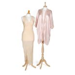 A 1930s ladies vintage pink satin bed robe with a pale pink lace trim,