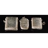 Two hallmarked silver cushioned rectangular vesta cases, one engine turned,