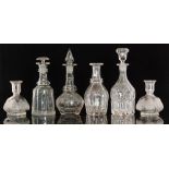 A group of 19th Century and later clear glass decanters comprising two with pillar cut decoration,