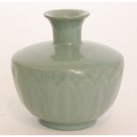 A small Chinese vase of compressed form with a squat flared neck,