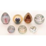 A group of Okra studio glass paperweights comprising a limited edition paperweight titled Floating