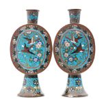 A pair of late 19th Century cloisonne vases each of oval form raised to a flared foot with a collar