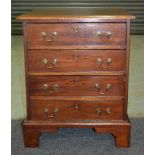 A small mahogany chest of four cockbeaded drawers in the Georgian style,