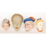 Four assorted 1930s Art Deco face masks comprising two Goebel examples,