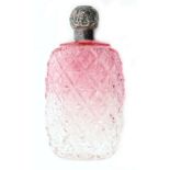 A hallmarked silver topped glass scent bottle,