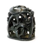 A Chinese black jade pierced and carved depiction of mythical birds eating leaves amidst scrolling