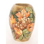 A Moorcroft Pottery vase decorated in the Flame of the Forest pattern designed by Philip Gibson,