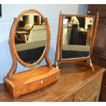 A 19th Century mahogany toilet swing mirror of oval form,