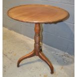 A Georgian and later mahogany snap top supper table of dished circular form,