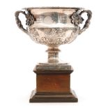 A hallmarked silver twin handled bowl in the manner of a Warwick vase with embossed oak leaf