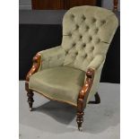 A Victorian mahogany framed easy chair upholstered in green buttoned back plush,