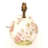 A Moorcroft Pottery ovoid lamp base decorated in the Spring Blossom pattern designed by Sally