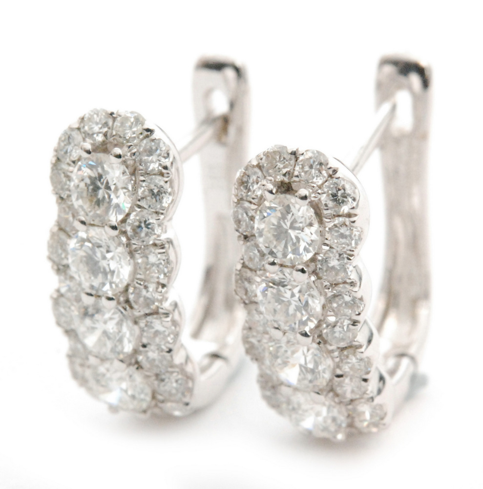 A pair of 18ct diamond cluster earrings, four round brilliant cut diamonds vertically set,