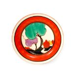 A Clarice Cliff Green Autumn circular side plate circa 1930 hand painted with a stylised tree and