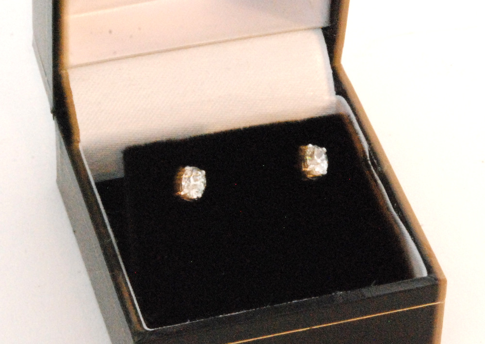 A pair of 18ct white gold oval cut diamond stud earrings, each weighing approximately 0.