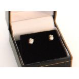 A pair of 18ct white gold oval cut diamond stud earrings, each weighing approximately 0.