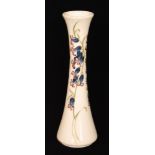 A Moorcroft Pottery vase of slender waisted form decorated in the Bluebell Harmony pattern designed