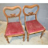 A set of four Victorian carved mahogany drawing room chairs with pierced backs overstuffed crimson