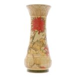 A Moorcroft Pottery vase of slender waisted form decorated in the Amber pattern designed by