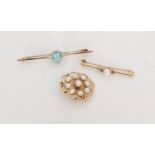A 9ct hallmarked circular brooch set with nine cultured pearls,