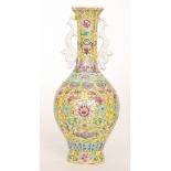 A later 20th Century Chinese famille jaune bottle vase decorated with chrysanthemum,