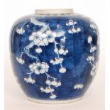 A late 19th Century Chinese ginger jar base (lacking cover) decorated in blue and white prunus