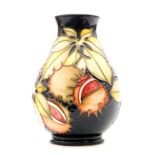 A small Moorcroft Pottery baluster vase decorated in the Endangered Species pattern designed by