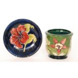 Two pieces of Moorcroft comprising a jardiniere decorated in the Columbine pattern, height 12.