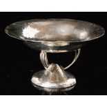 An Arts and Crafts planished pedestal dish,