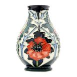A Moorcroft Pottery vase decorated in the Poppy pattern designed by Rachel Bishop,