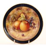 A small Royal Worcester Fallen Fruits cabinet plate decorated by P.