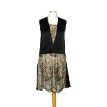 A 1920s ladies vintage Art Deco drop waist black satin dress with inset lace panels to the V neck,