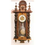 A late 19th Century walnut cased regulator wall clock with spring driven movement enclosed by a