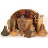 Three 20th Century various sized African drums, two combs, a woodblock print,