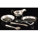 Five items of assorted hallmarked silver to include a sauce boat,