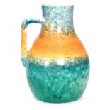 A Ruskin Pottery crystalline glaze flower jug decorated in a mottled blue to orange to green glaze,