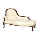 A Victorian carved mahogany framed chaise longue of serpentine outline,