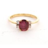 An 18ct hallmarked ruby and diamond ring,