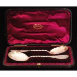 A pair of Victorian hallmarked silver spoons, each with gilt bowl and twisted stem,