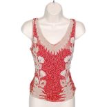 A 1920s ladies vintage beaded bodice top in a red pink chiffon with a white and clear beadwork