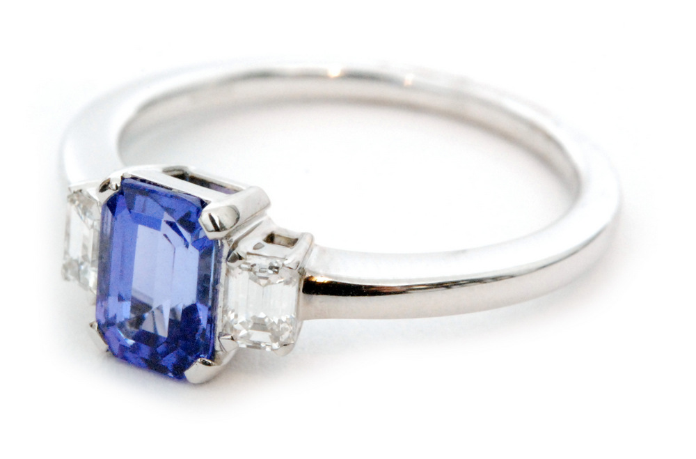 An 18ct white gold tanzanite and diamond three stone ring,